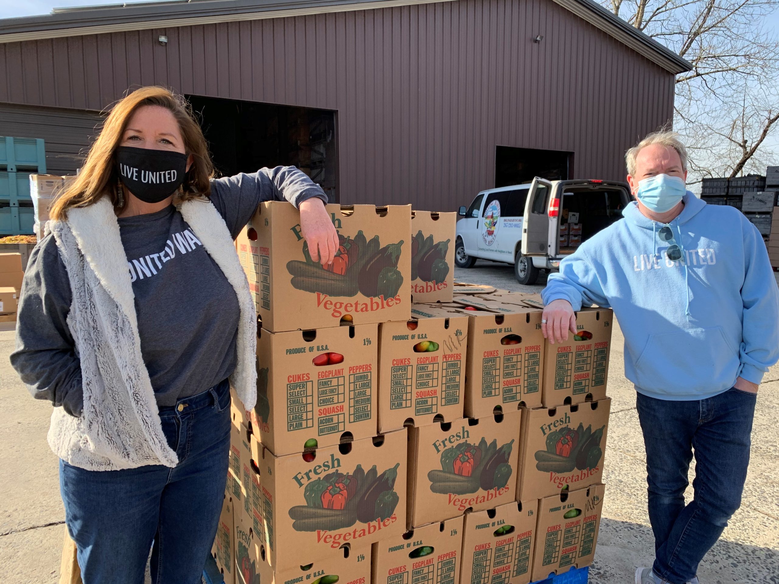 Tim and Joanne with Vegetable boxes